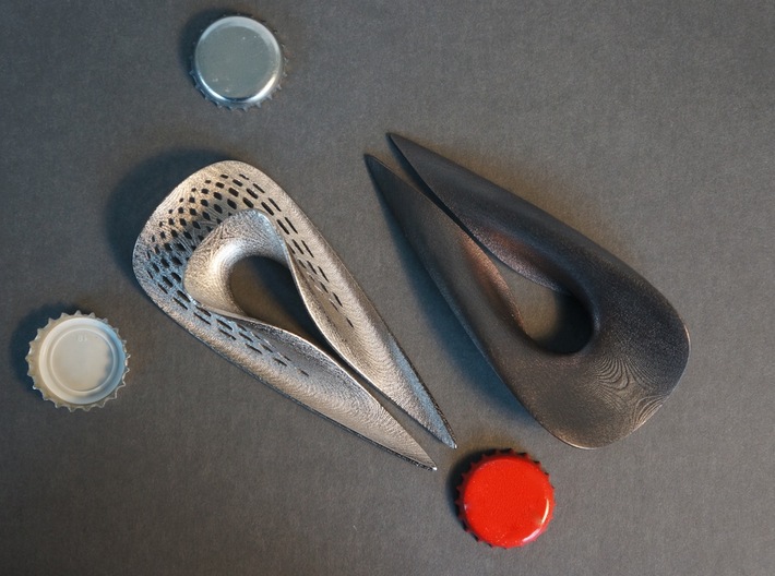 Splendor Solis - Bottle Opener - Perforated 3d printed Left: Polished Nickel with Pattern. Right: Polished Grey without Pattern  