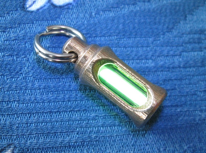 Tritium Lantern 1D Shorty (3x11mm Vials) 3d printed In this picture the phosphorus coating on the tritium vial being energised by UV light.
