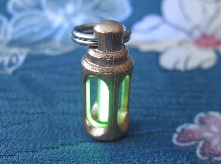 Tritium Lantern 1D Shorty (3x11mm Vials) 3d printed In this picture the phosphorus coating on the tritium vial being energised by UV light.