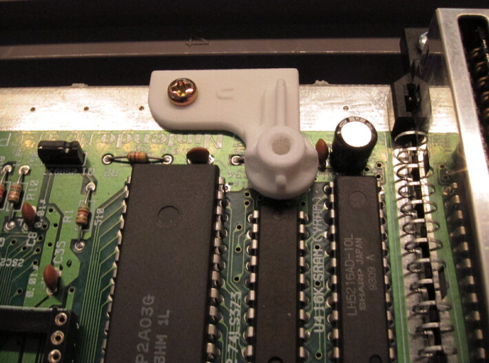 NESRGB PCB Standoff for NES 2 Top Loader 3d printed Use existing screw to fasten the standoff.