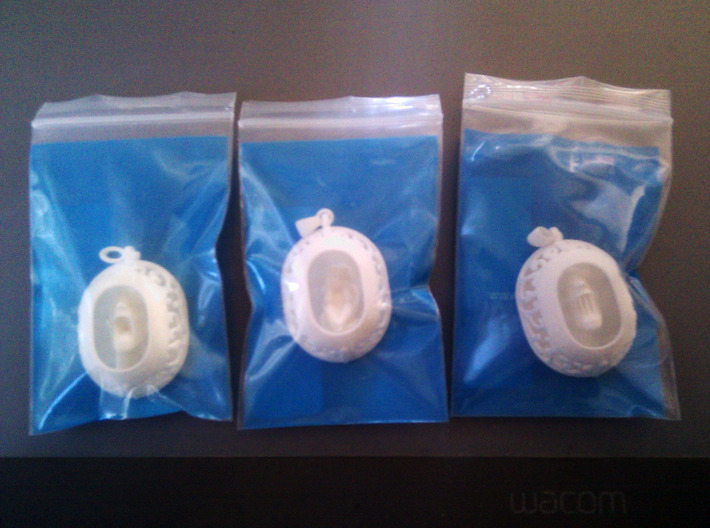Cherub Pendant 3d printed 3 pendants in shapeways packaging bags