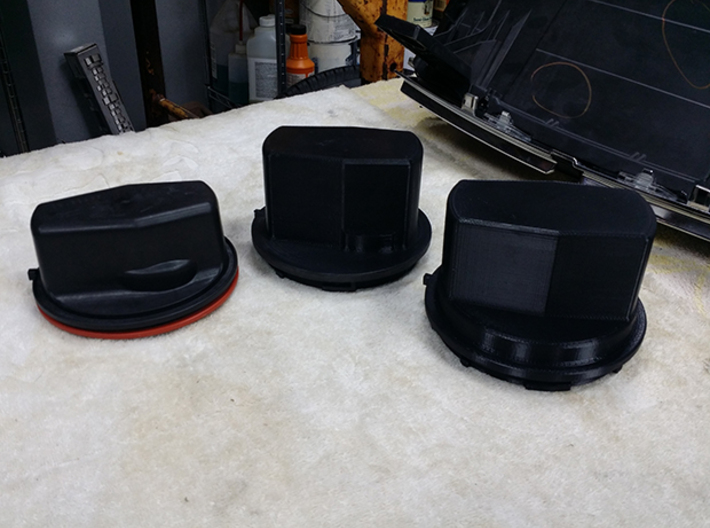 A single Thinner Extended Silverado headlight cap 3d printed These are pictures of the prototyping models so you can see the size and how they fit.
