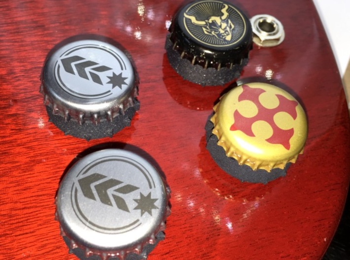 Bottlecap Tone Knob - 6MM 3d printed A set of 4 bottlecap knobs in black on a cherry SG background.