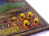 Power Grid Yellow Uranium Barrels, Set of 12 3d printed Uranium Barrels shown on Power Grid game board.