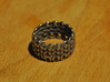 Knitter's Ring (59mm) 3d printed The ring in stainless steel.  This model came from Shapeways with a bit of residue stuck in the cracks between stitches.  I removed the excess material with a needle.