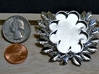 Laurels' Medallion 3d printed In polished silver with coins to scale by.  