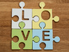 Puzzle Piece V - "Love-letters" 3d printed 4 puzzle pieces combined to write the word "love".