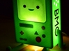 BMO Lamp in Color 3d printed Lit with a 7watt bulb.  Comes across more as a night light than a lamp.