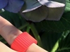 Ingranaggi Band Ring 3d printed Red Strong & Flexible Plastic on a lilac "ortensie" background