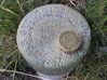 Early USGS Benchmark Pipe Cap - Michigan 3d printed Raw bronze with patina sitting on the actual benchmark.