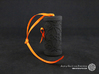 Solid Gift roll small with Mosaic-3 (6 cm) 3d printed The photo shows a print made of black strong and flexible incl. orange lacing.
