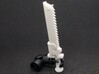 Action Figure Chainsword - Right Handed 3d printed Printed in White Natural Versatile Plastic, held by the hand of a 1:12 scale action figure arm, Left Handed version shown