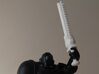 Action Figure Chainsword - Right Handed 3d printed Printed in White Natural Versatile Plastic, held by the hand of a 1:12 scale action figure, Left Handed version shown
