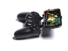 Controller mount for PS4 & Micromax A119 Canvas XL 3d printed Side View - A Samsung Galaxy S3 and a black PS4 controller